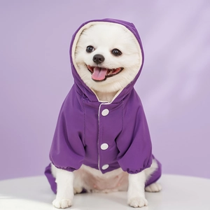 Close-up of waterproof purple pet jumpsuit with snap buttons and elastic cuffs for small dogs