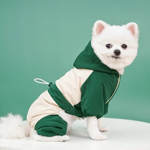 Detail of waterproof green pet ski suit with adjustable drawstring and elastic cuffs