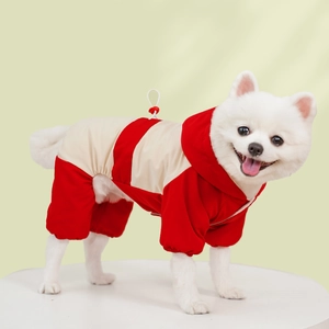 Waterproof hooded pet snowsuit with red and white color blocking and traction buckle