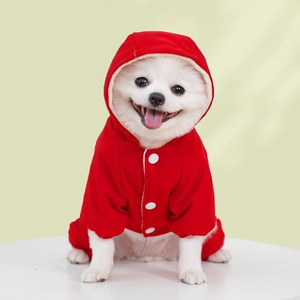 Detail of red pet snowsuit featuring white buttons and warm sherpa fleece hood lining