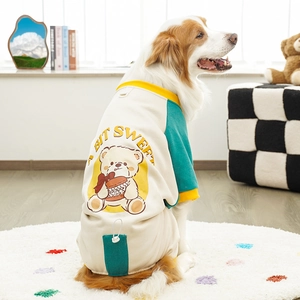 Detail of a color-block pet sweatshirt featuring a cute cartoon bear and soft fleece fabric