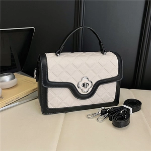 Chic quilted black and white crossbody handbag with floral twist lock and top handle