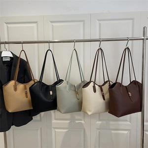 Large tote bag with leather straps and metal buckles in five earthy colors for women
