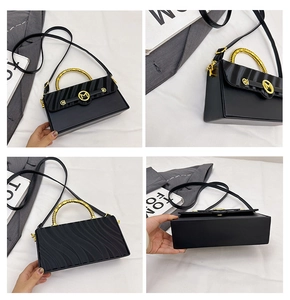 Detail view showing black leather crossbody bag with wave texture and gold metal M logo