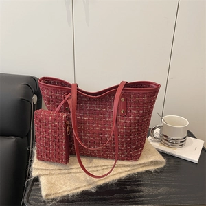 Red tweed tote bag with matching pouch featuring elegant golden hardware accents
