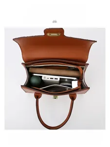 Spacious interior of brown textured tote bag showing capacity for iPad and daily essentials
