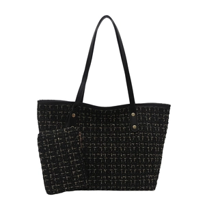 Tweed tote bag set with gold metallic accents and black leather handles in a classic design