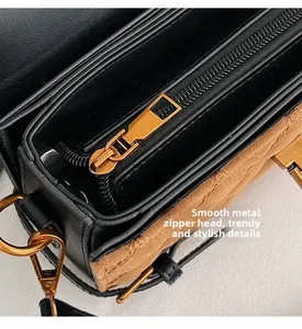 Macro detail of smooth metal zipper and vintage gold hardware on quilted leather bag