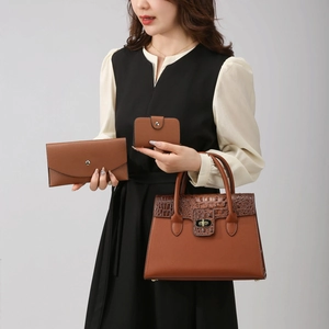 Three-piece women's caramel brown tote bag set with crocodile pattern and metal lock