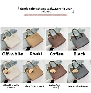 Detail showing various colors and textures of large tote bags with plush pendants