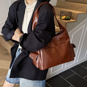 Vintage brown leather shoulder bag with metallic studs and large capacity for women
