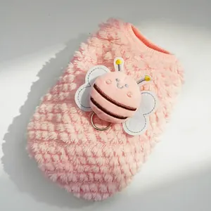 Detail of pink fleece pet vest with 3D bee applique and metal D-ring for leash attachment
