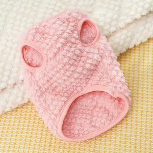 Close-up of pink fleece pet vest showing soft textured fabric and elastic hem detailing