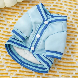 Detail of light blue pet baseball jacket showing soft fleece lining and white snap buttons