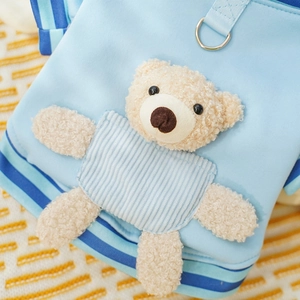 Close-up of pet baseball jacket with 3D teddy bear plush and metal D-ring attachment