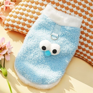 Detail of blue plush pet vest with D-ring and cartoon eyes on sheep-fleece fabric