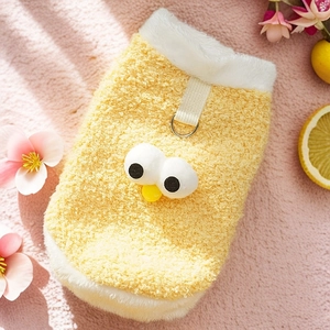 Detail showing the yellow fleece pet sweater with cartoon eyes and metal D-ring attachment