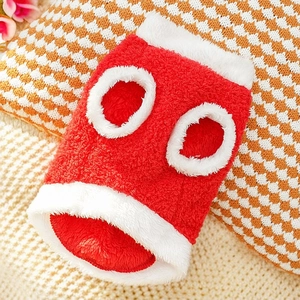 Detailed close-up of thick red coral fleece pet vest with soft white plush trim for cats