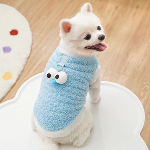 Close-up of light blue fleece pet vest with 3D cartoon eyes and a metal leash ring
