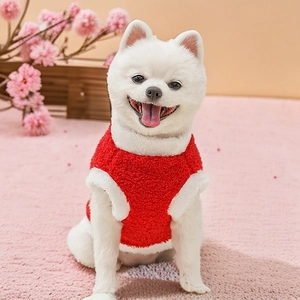 Close-up of thick red dog vest with white plush collar and soft fleece texture