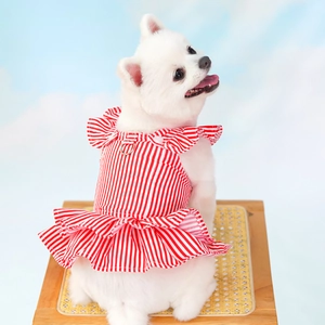 Detail of red and white striped pet dress with ruffled edges and built-in metal D-ring