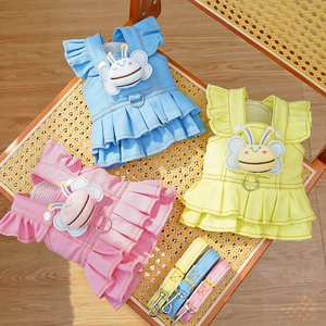 Detail of dog denim harness dresses in blue, yellow and pink with cute bee ornaments