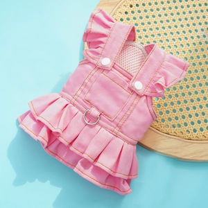 Detailed view of pink denim pet dress featuring metal D-ring and ruffle shoulder straps
