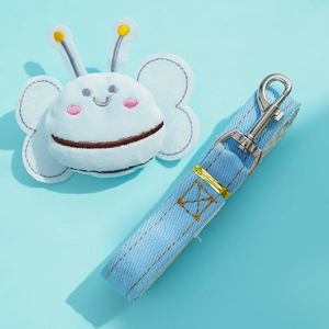 Close-up of blue denim pet leash with metal swivel hook and plush butterfly accessory