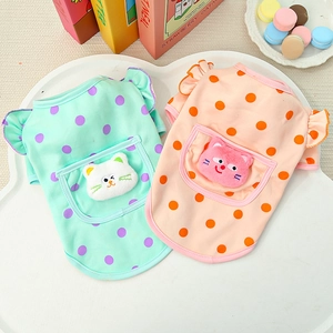 Detail of pet vests with polka dots, cat ornaments, and ruffled sleeves