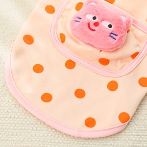 Close-up of pink dog shirt with orange polka dots and a plush 3D cat pocket