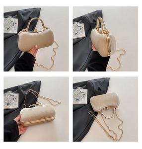 Detail view of champagne velvet evening box bag with diamond metal handle and gold chain