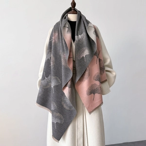 Women's autumn poncho scarf with pink and grey ginkgo leaf print and fringe edges