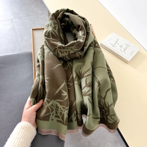 Close-up of bamboo print scarf with fine fringe detail and soft cashmere texture