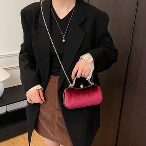 Elegant burgundy velvet box bag with silver metal handle and chain strap for evening events