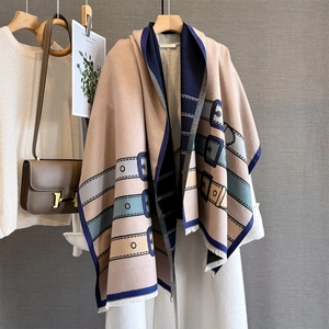 Close-up of retro belt buckle pattern and soft fringe on thick jacquard scarf