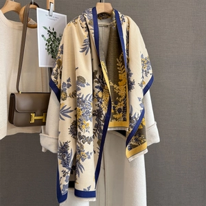 Floral cashmere-like scarf with fringe on white coat with floral pattern details