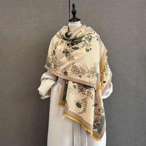 Close-up of vintage floral pashmina scarf featuring yellow fringe and thick jacquard fabric