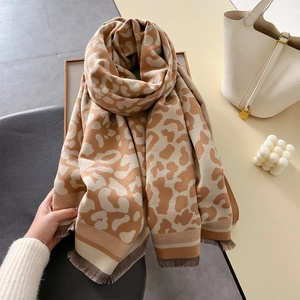 Thick leopard print cashmere shawl with grey fringe tassels and warm knitted texture