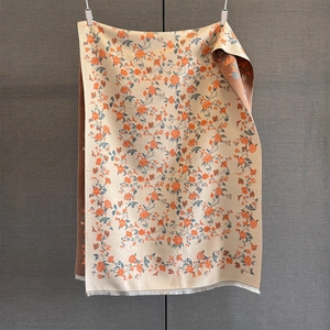 Detail of rose floral scarf showing double-sided jacquard pattern and fringe edges