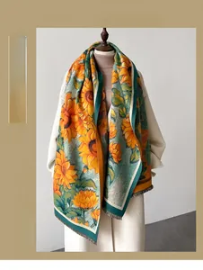 Detail of warm sunflower print scarf with fine fringe edges on a white mannequin