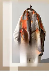 Detailed texture of orange ginkgo leaf pattern on thick warm autumn winter scarf