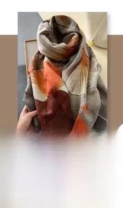 Detailed texture of thick ginkgo leaf pattern pashmina scarf with fringe tassels