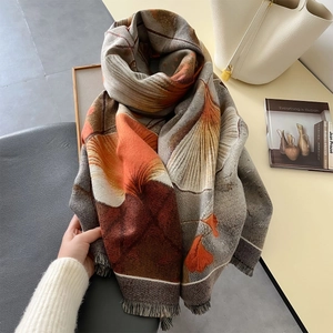 Thick warm scarf with ginkgo leaf print and tassel fringe in grey and orange