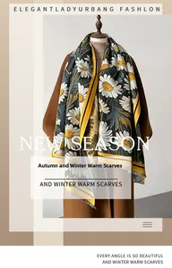 Detailed view of sunflower print pashmina shawl with tassel trim and thick knit texture