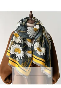 Detail of sunflower pashmina scarf featuring thick knit fabric and soft white daisy prints