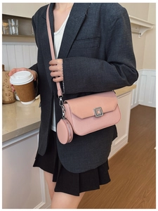 Pink leather crossbody bag with square metal buckle and matching round coin purse detail