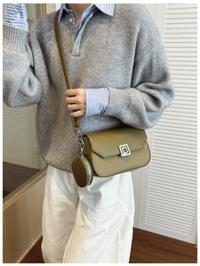 Olive green square handbag with woven texture and mini round pouch shown on model