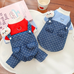 Close-up of polka dot denim pet overalls with cute plush bear and metal D-ring attachment