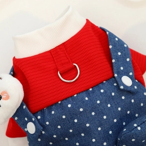 Close-up of pet jumpsuit with red waffle knit texture and navy polka dot denim overalls