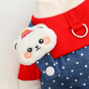 Close-up of pet denim overalls with plush bear mascot and D-ring for dog leash